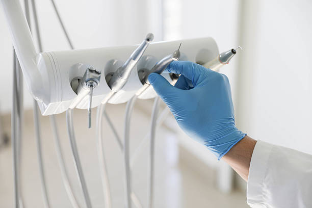 Professional Root Canal Treatment technician working in Delhi, LA